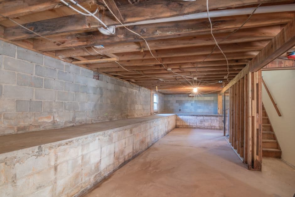 A block basement foundation wall in an older home