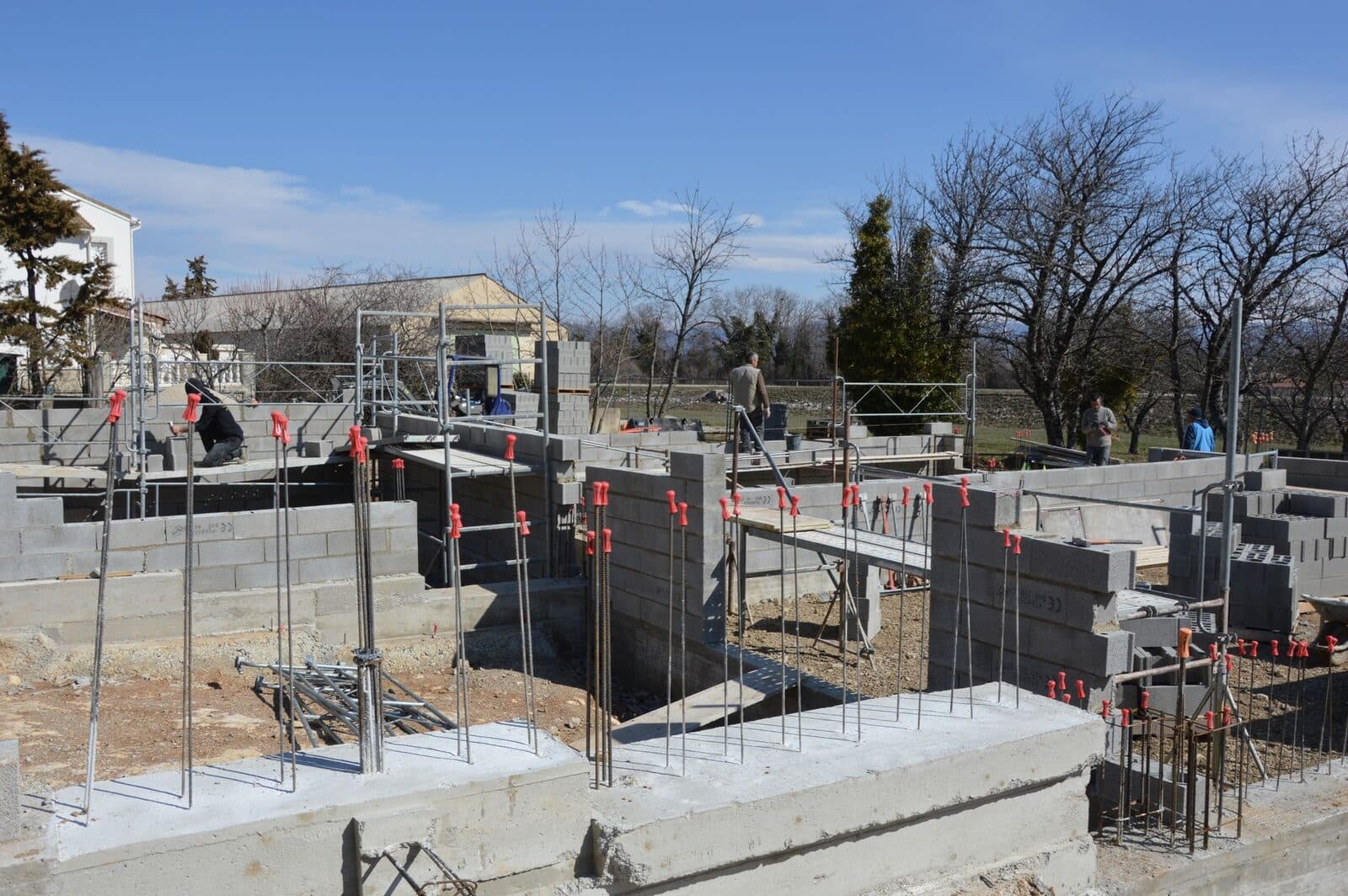 A poured and block concrete house foundation under construction